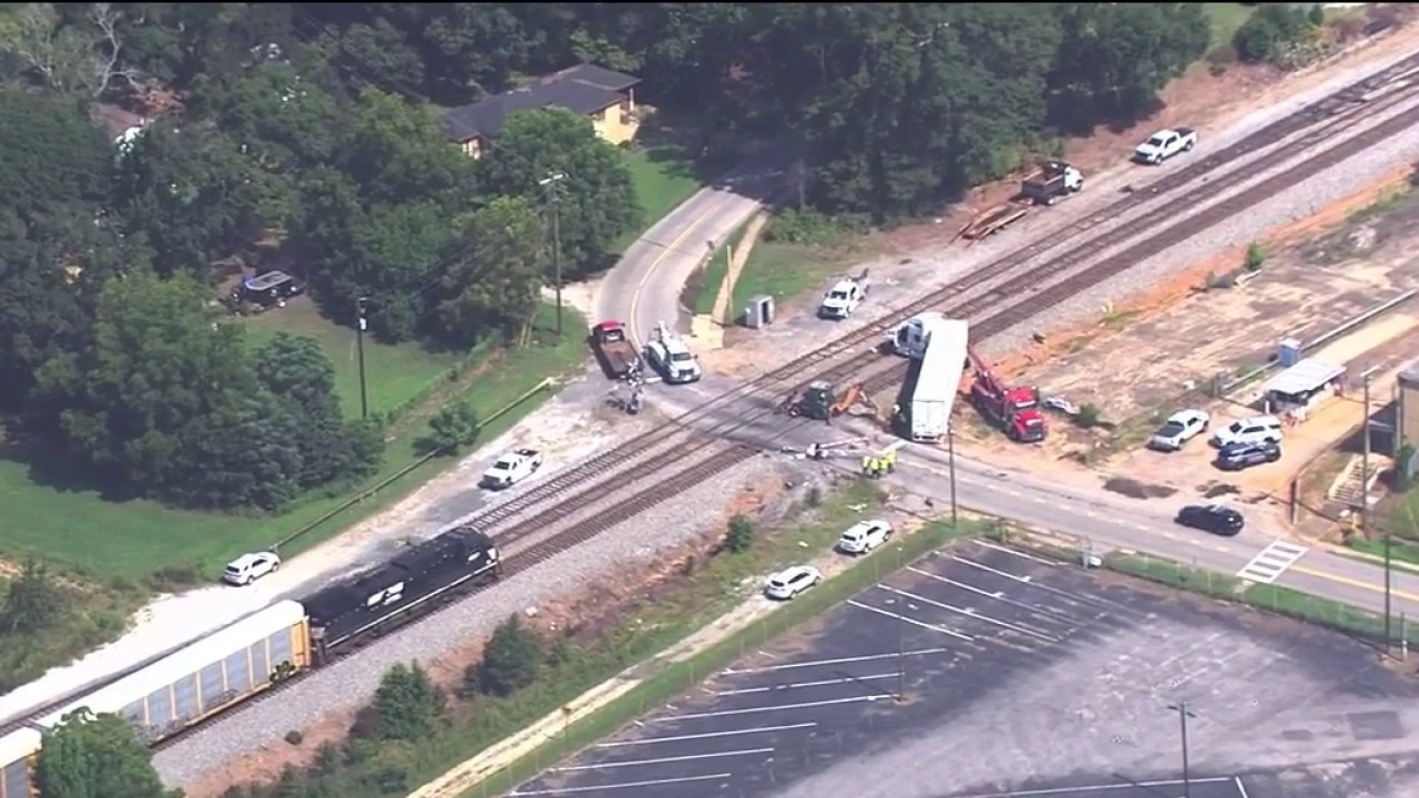 Crews respond after a train crashed into a tractor trailer