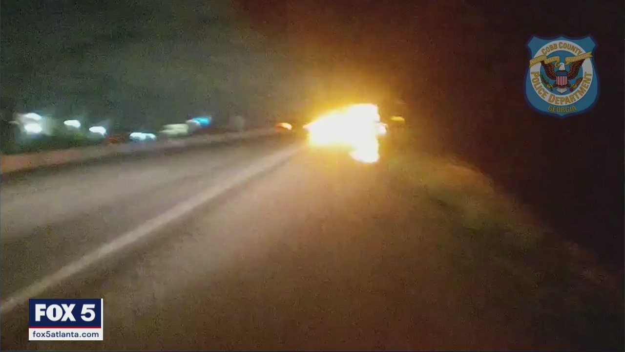 Woman pulled from burning car
