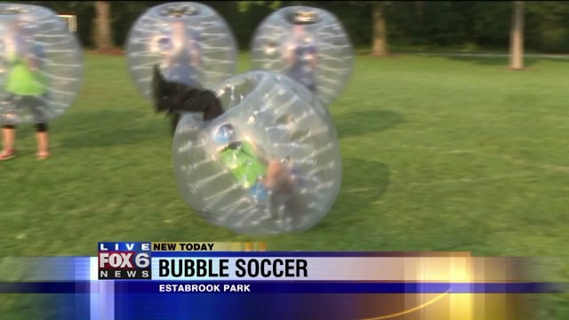 Laura plays Red Rover in the bubble suit