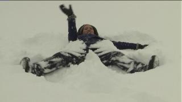 Angelica makes a snow angel