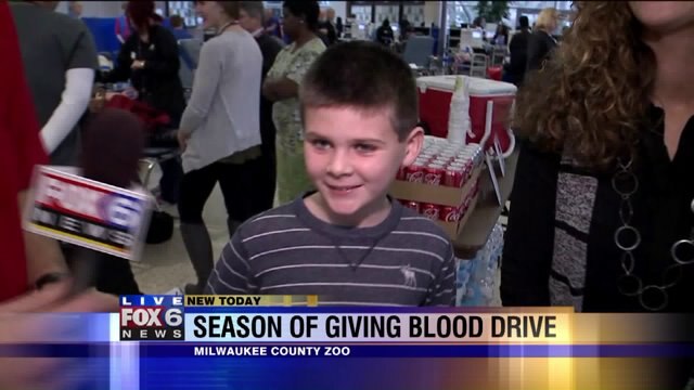 Carl talks with people who have benefited from the blood donations