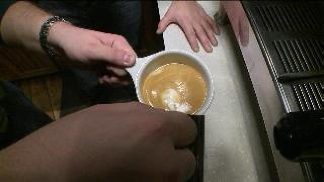 Tony learns how to make a latte