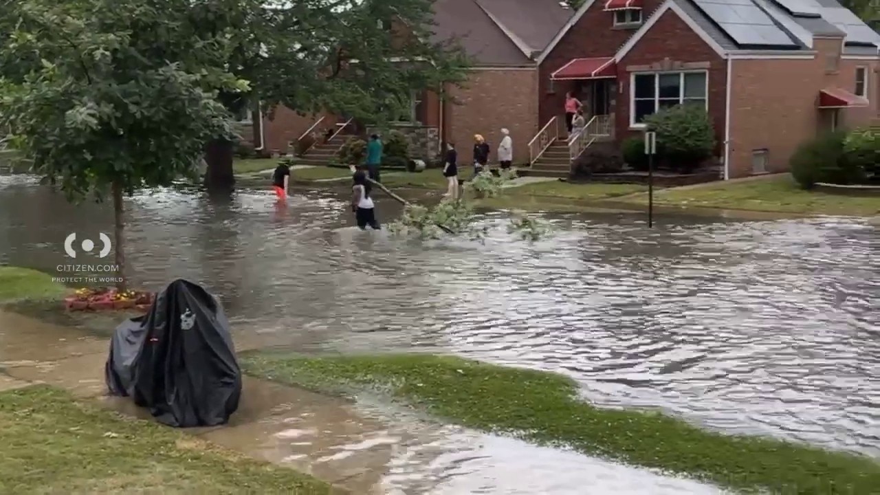 Summit neighborhood hit by street flooding and downed trees