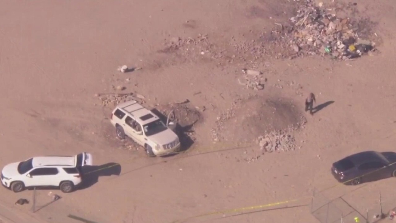 Cop shot during investigation; Other person dead