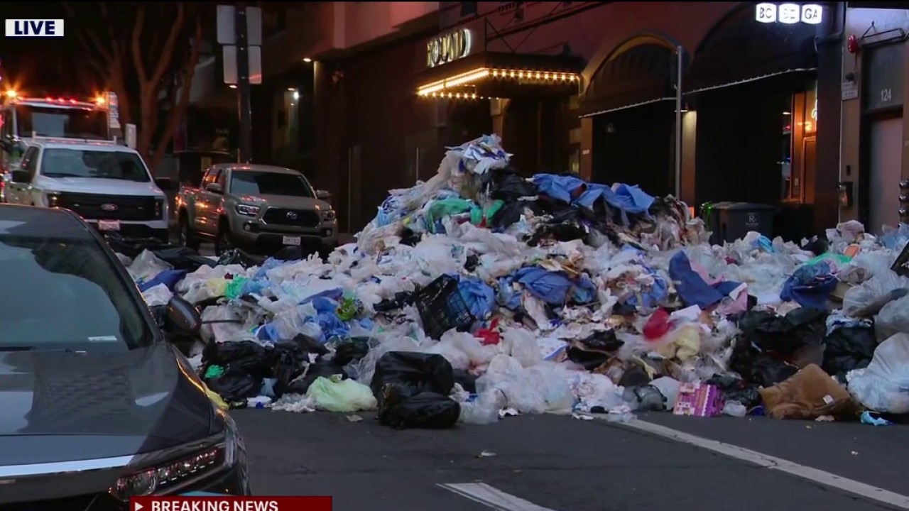 San Francisco firefighters rescue man from garbage truck