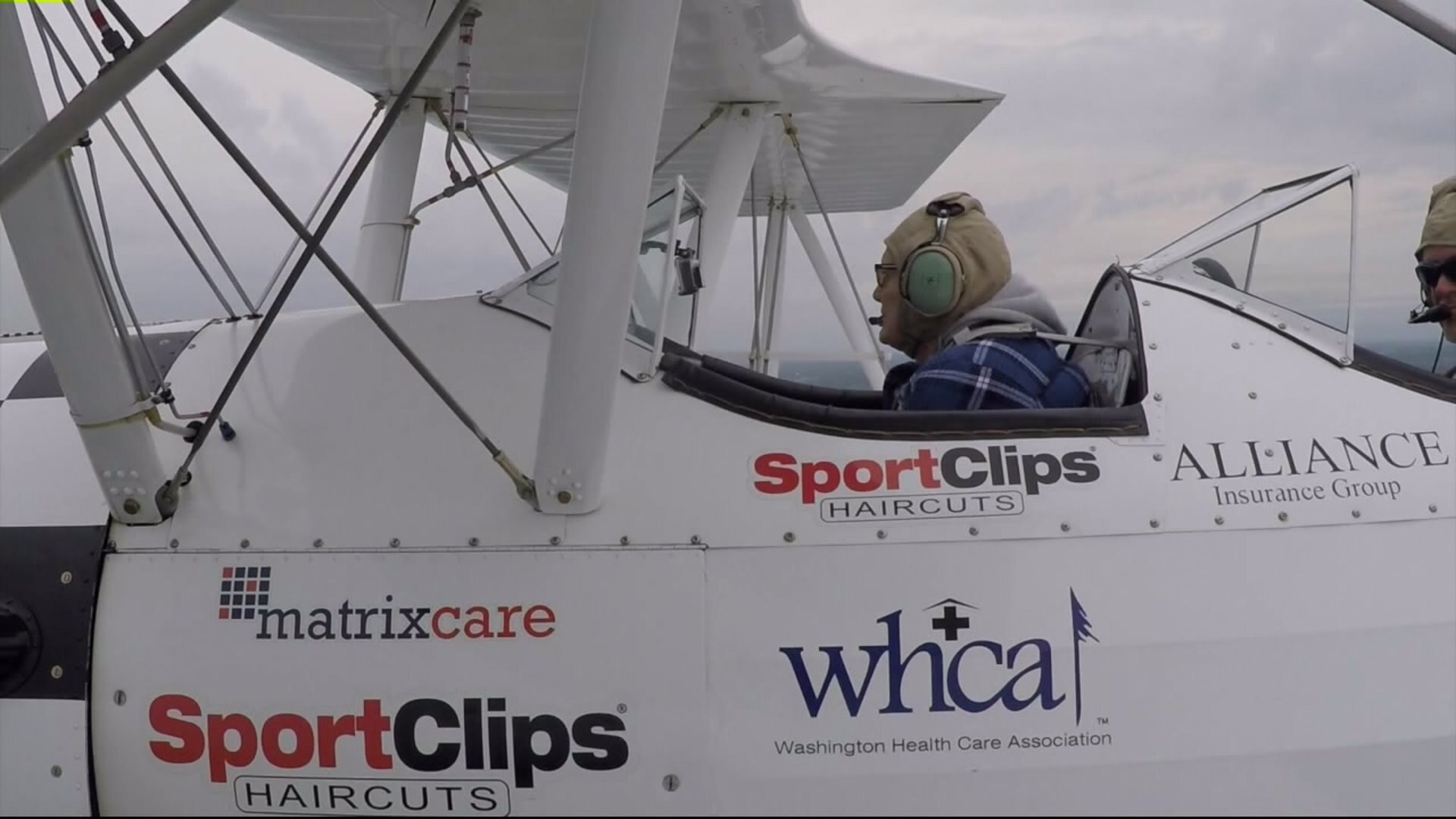 Eldery veterans fly in biplane