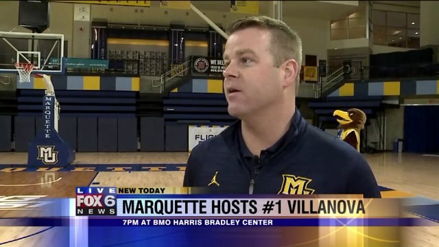 Carl talks with another coach ahead of the big game
