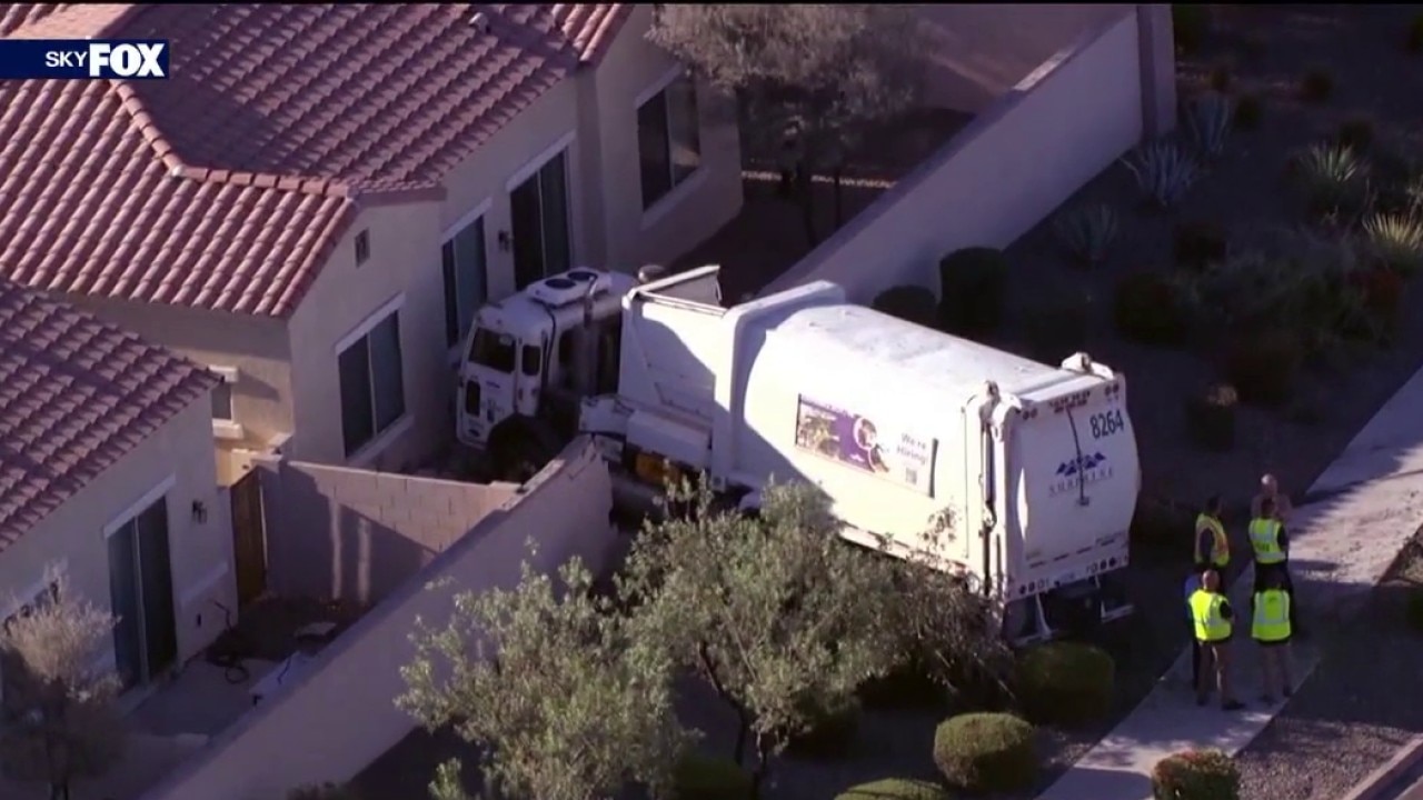 1 hurt after garbage truck crashes into Surprise backyard