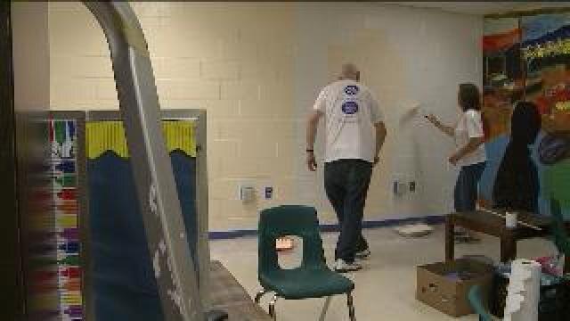 G.E. employees clean up schools