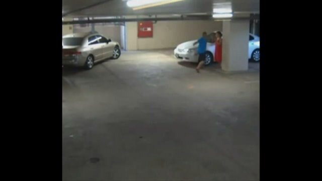 RAW: Surveillance video captures man punching woman in parking garage attack