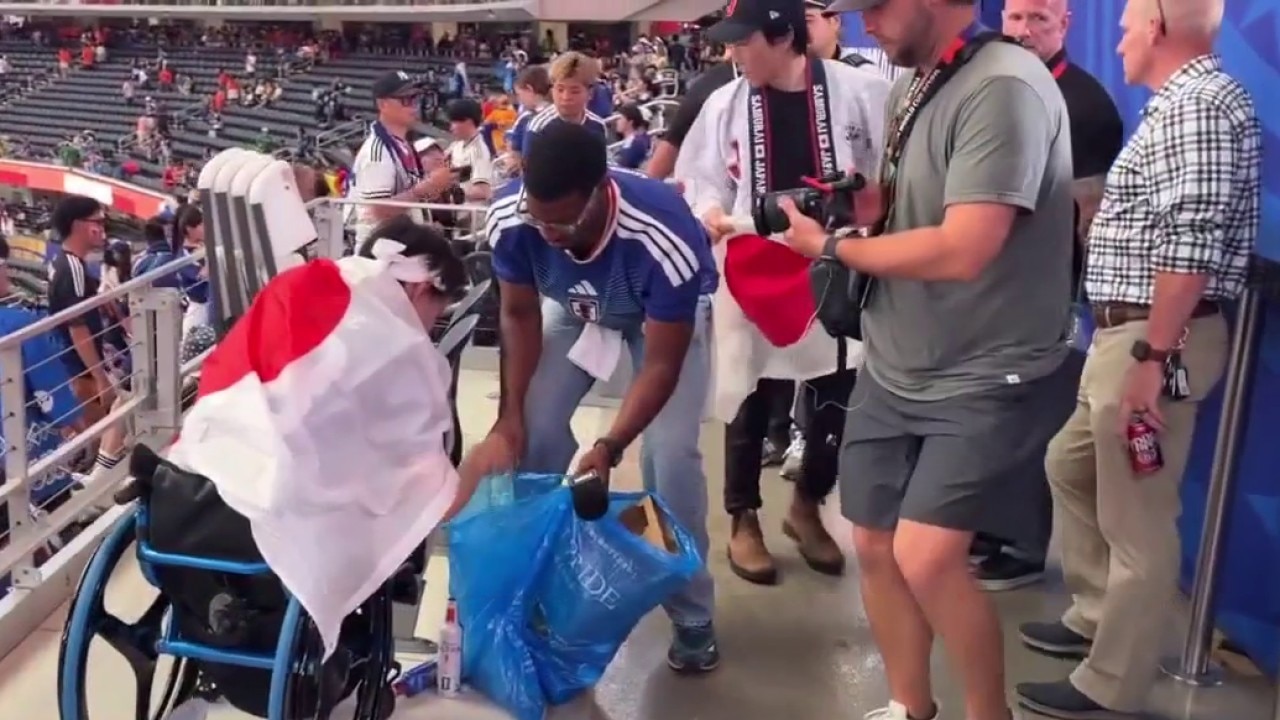 Japanese fans clean up after World Cup match