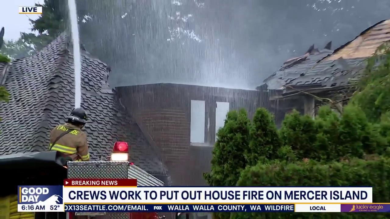 Crews work to put out house fire on Mercer Island