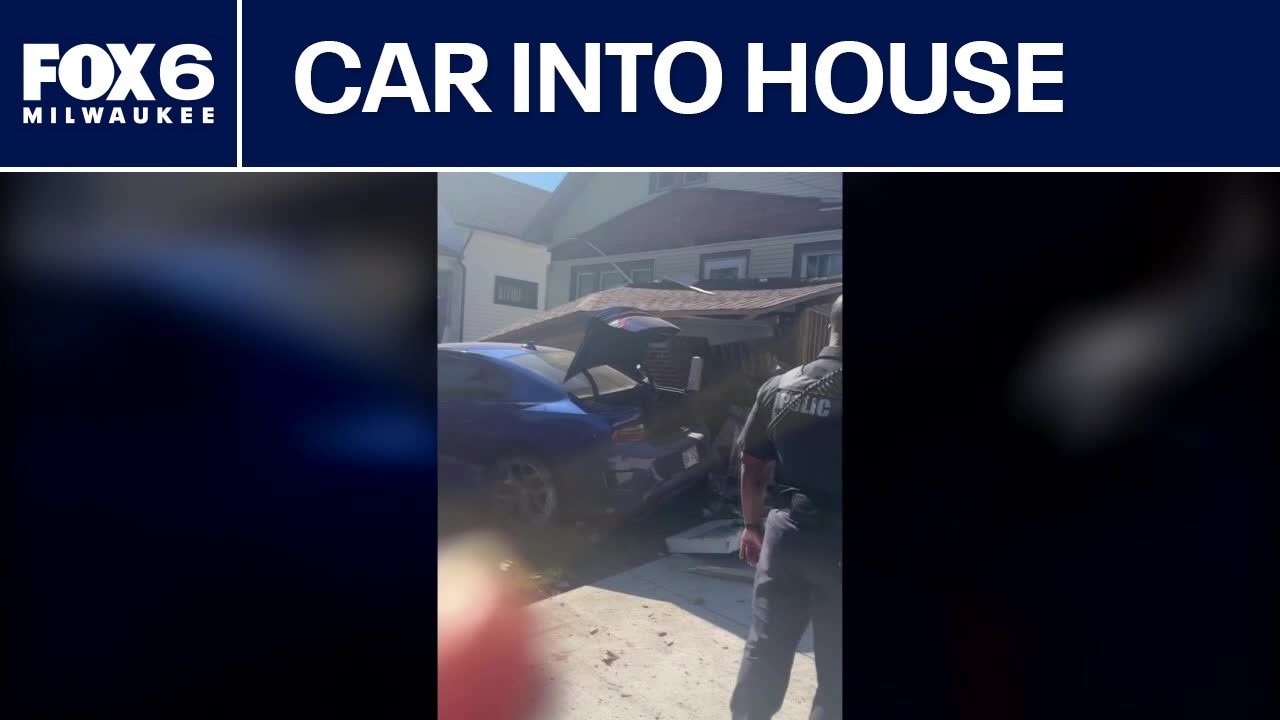 Car crashes into Racine house, porch collapses