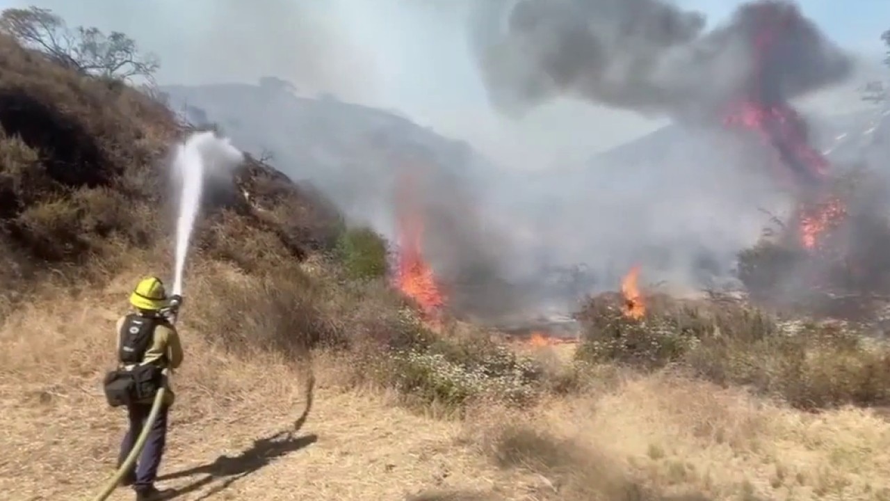 Burning car sparks brush fire in Burbank