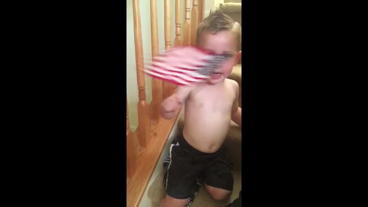 Local boy grabs flag says Pledge of Allegiance