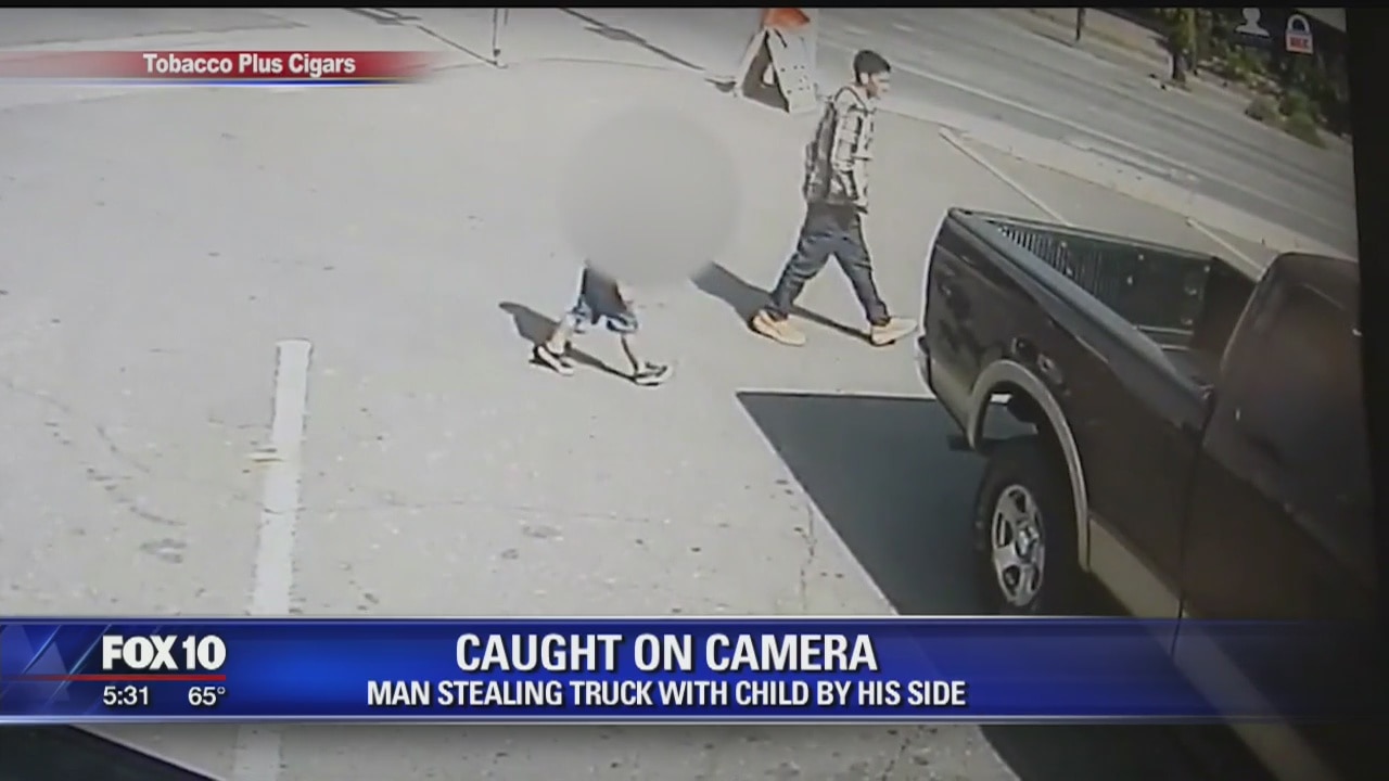 Man wanted for stealing truck, as a toddler stands beside him