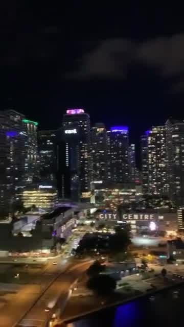 Miami residents under curfew cheer for medical workers from apartment balconies