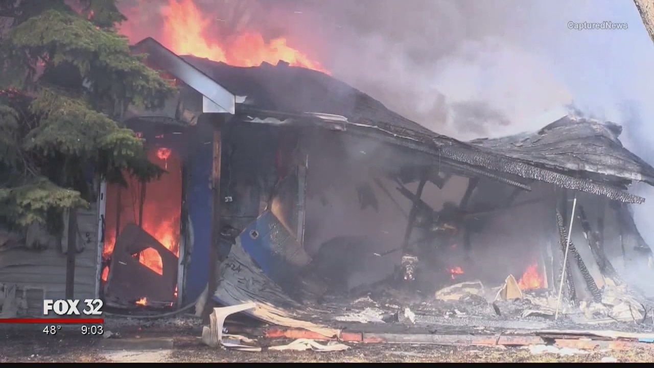Neighbors hear an explosion, then fire destroys two homes