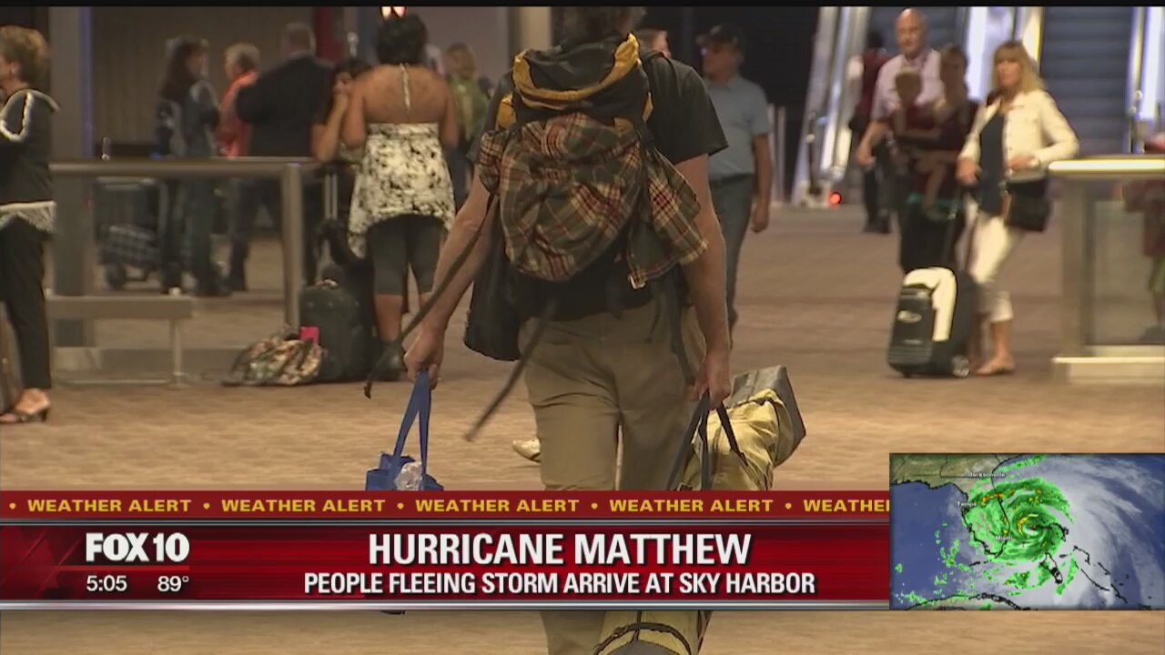 People fleeing Hurricane Matthew arrive at Sky Harbor
