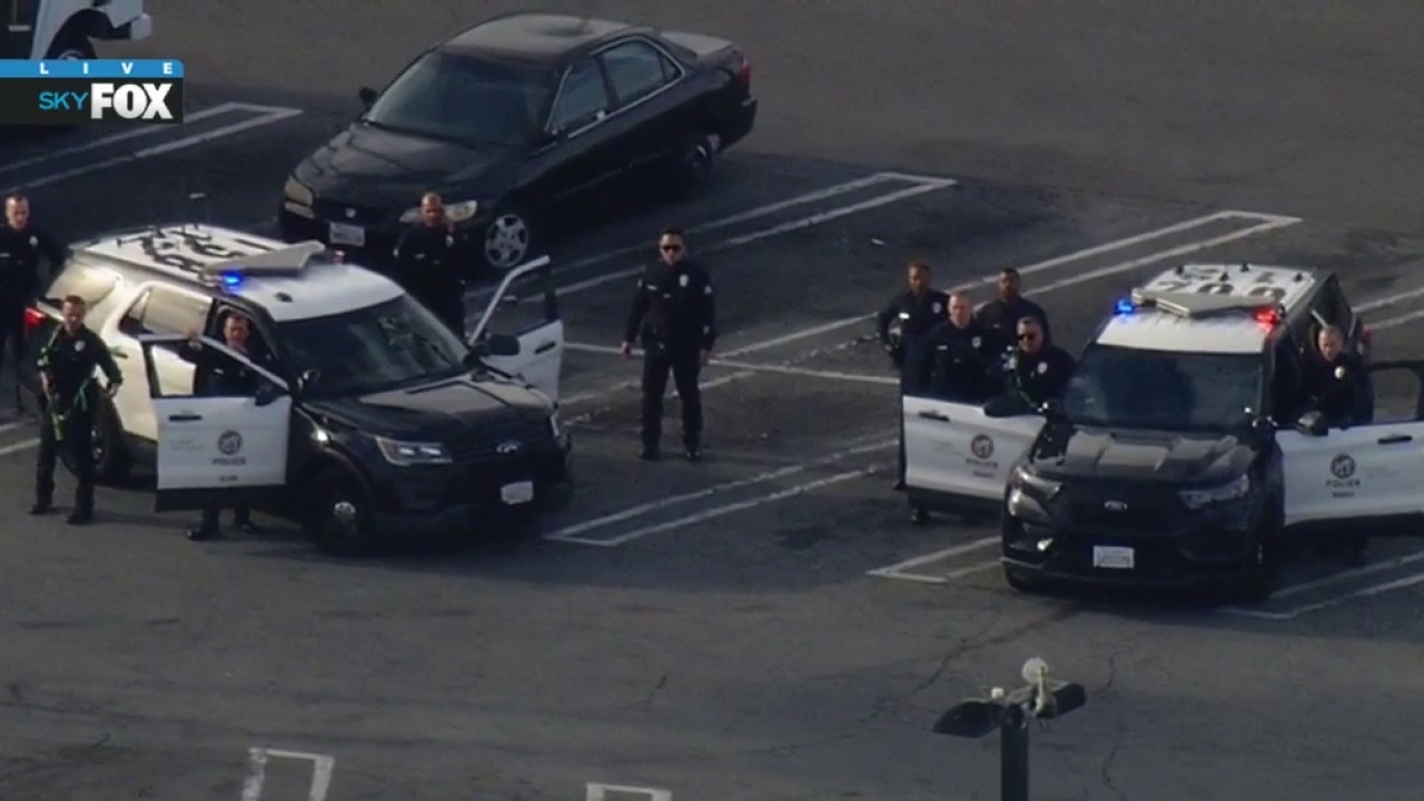 Armed suspect in South LA shopping center