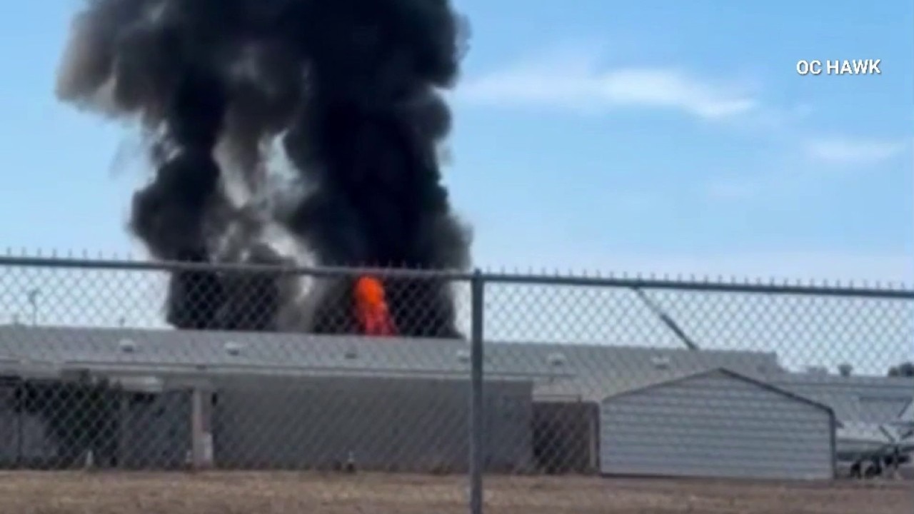 Towering flames, smoke from warehouse in Fullerton
