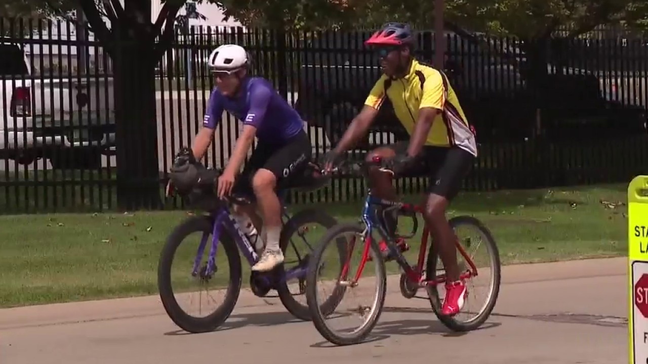 Cyclist's 11,000 mile journey passes through Lions training camp with Super Bowl ball