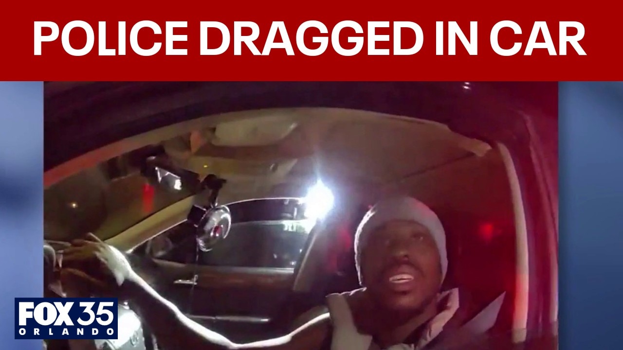 Video: 2 officers dragged in suspect's car after traffic stop, police say