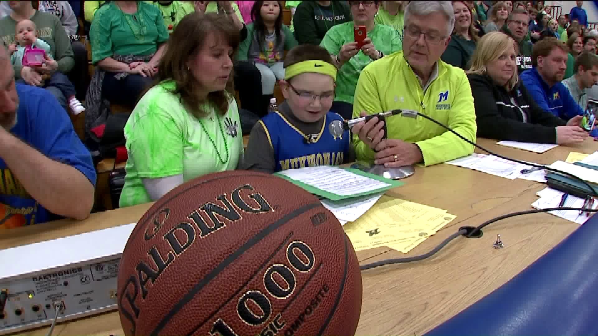 Boy with rare condition gets to serve as basketball announcer for a night