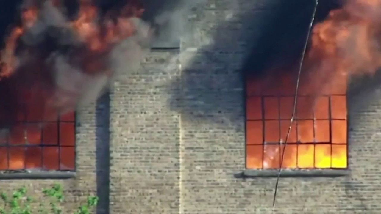 Woman arrested in 5-alarm Milwaukee warehouse fire