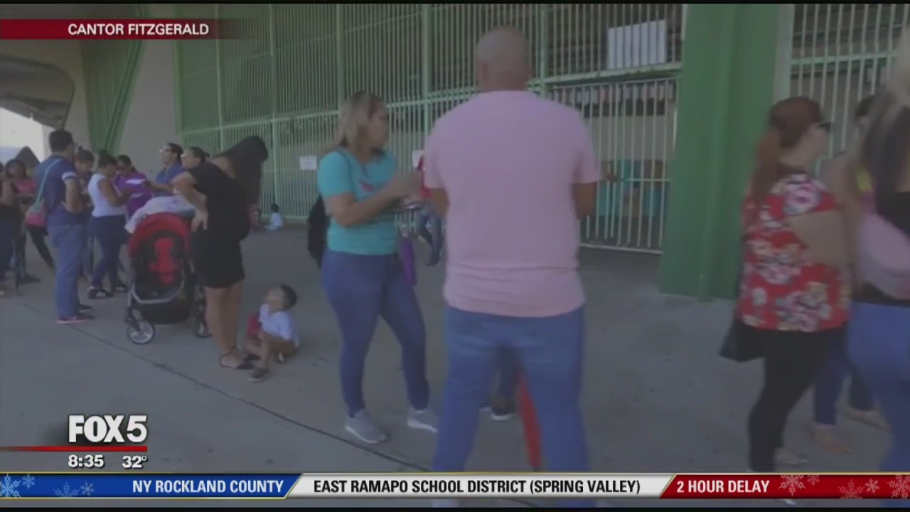 Hurricane survivors given $1K each