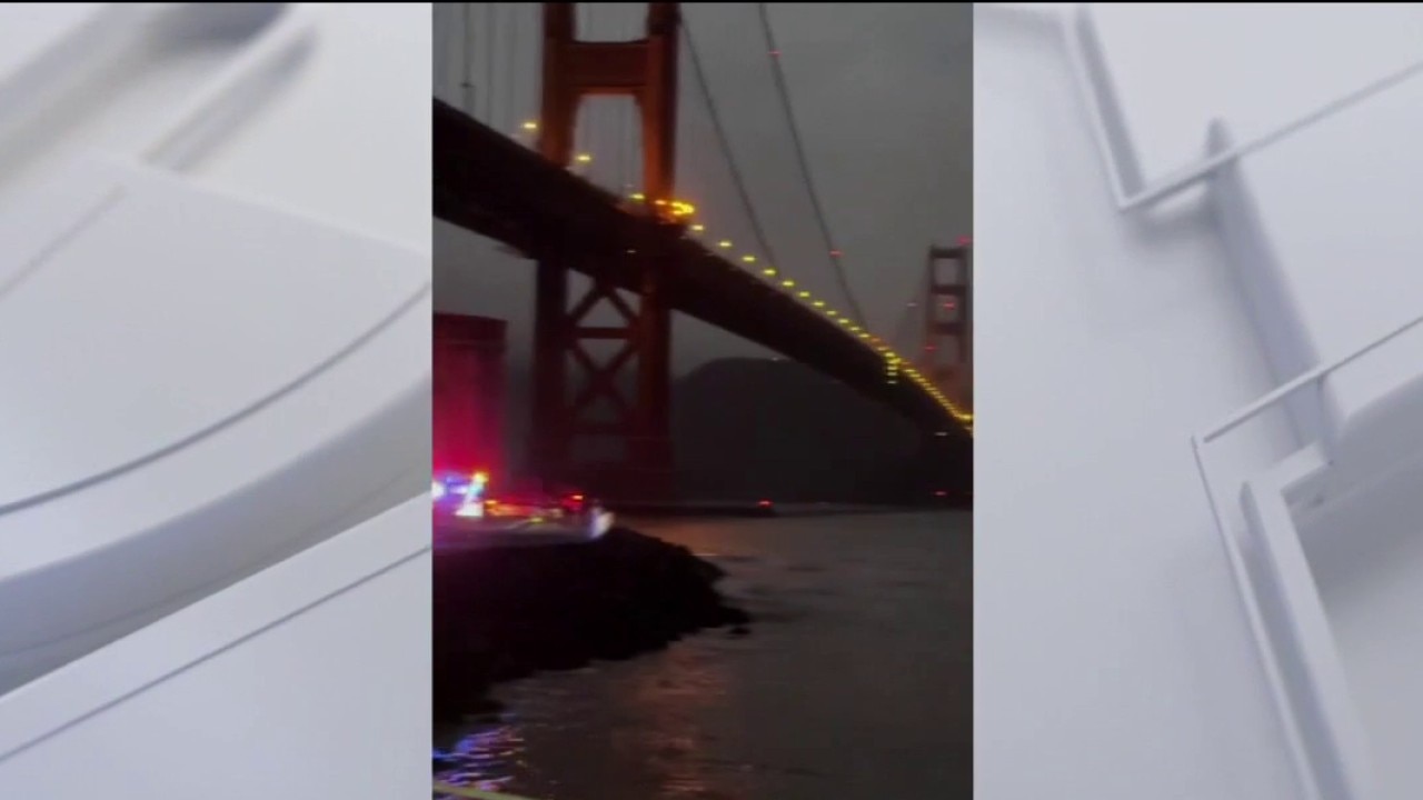 Fishing boat hits rocks by Golden Gate Bridge