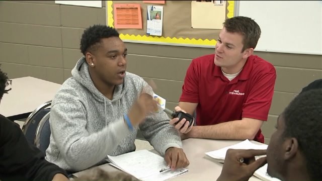 Chip learns about programs, talks with youth at COA