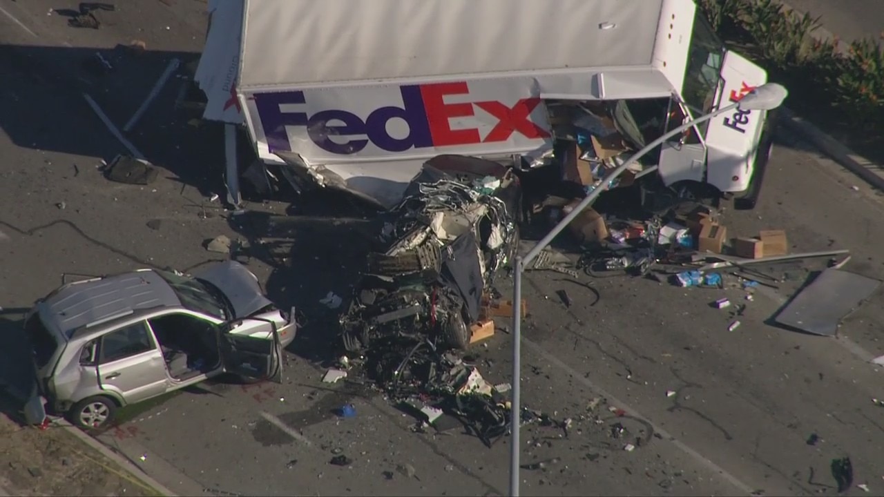 One killed in six-vehicle crash involving FedEd truck