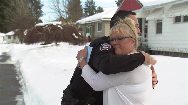 Officer reunited with woman he pulled from burning car
