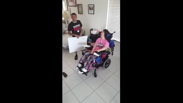 Woman left paralyzed after brutal attack surprised with 'prom-posal:' "The most priceless thing was her smile"