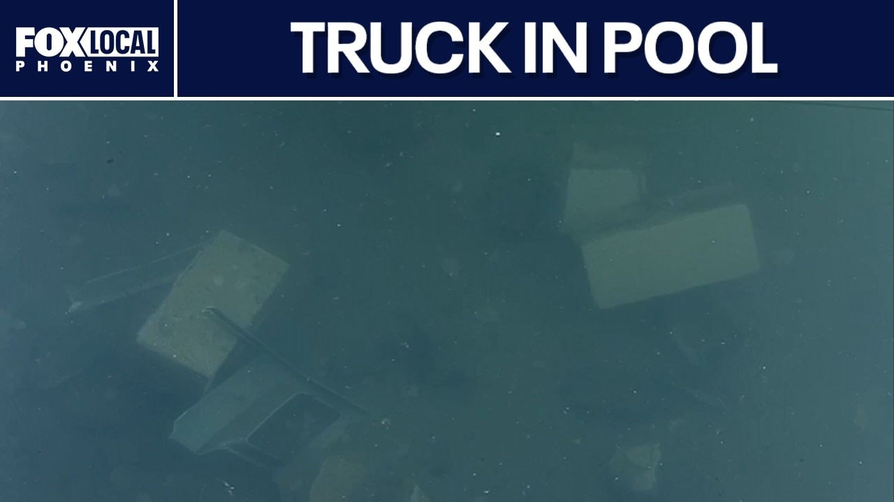 Truck crashes through wall into Gilbert pool