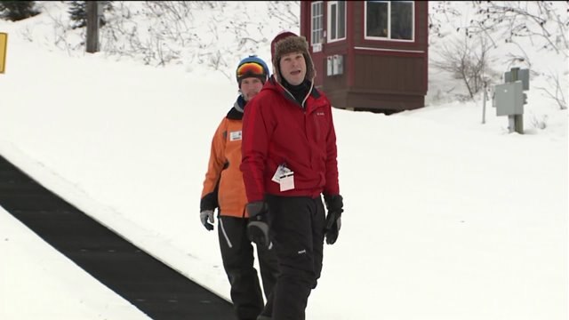 Chip learns how to do turns on a snowboard