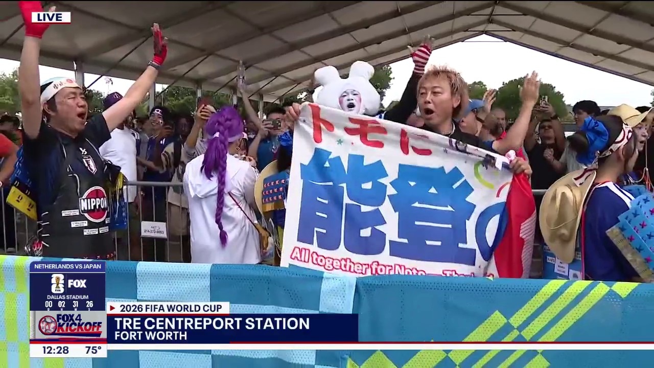 Japan fans chant before bus to World Cup match