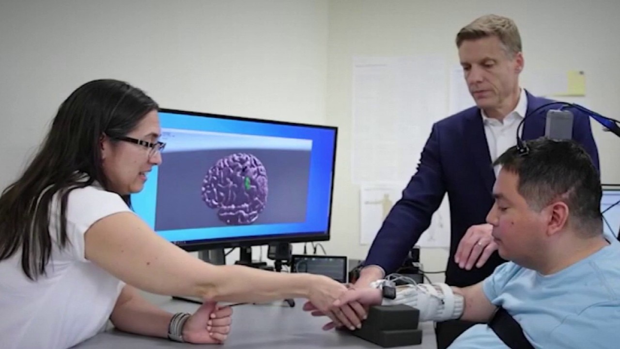 Paralyzed man able to move, touch again with AI