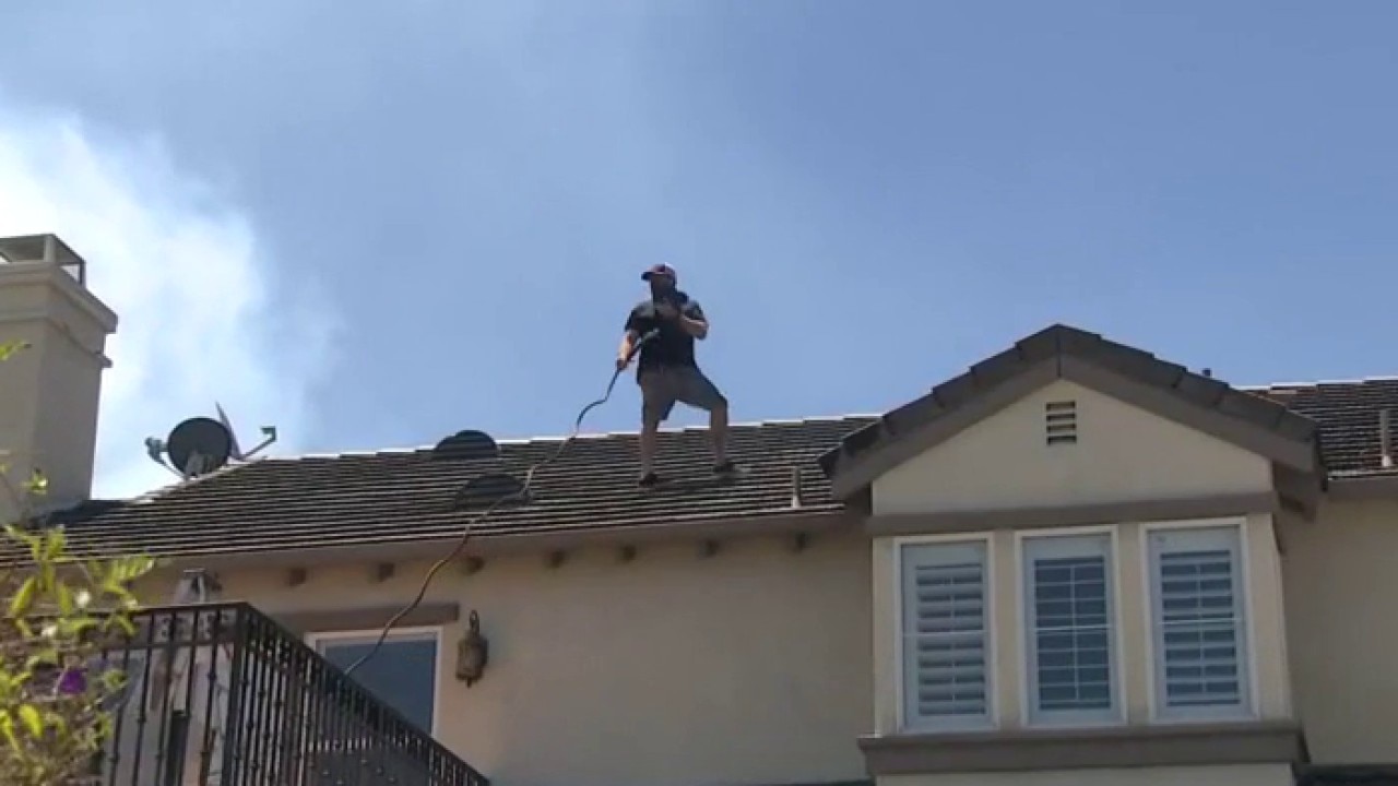 Simi Valley man aims to protect home with garden hose