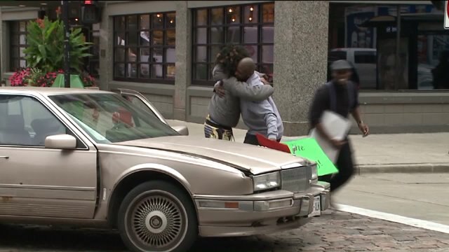 Students at Paul Mitchell School have a blast handing out hugs