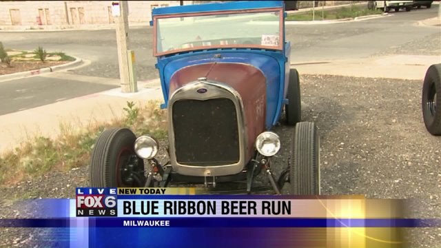 Laura checks out custom cars you can see at the Blue Ribbon Beer Run