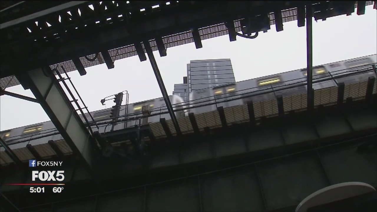Debris falls from elevated train in Queens