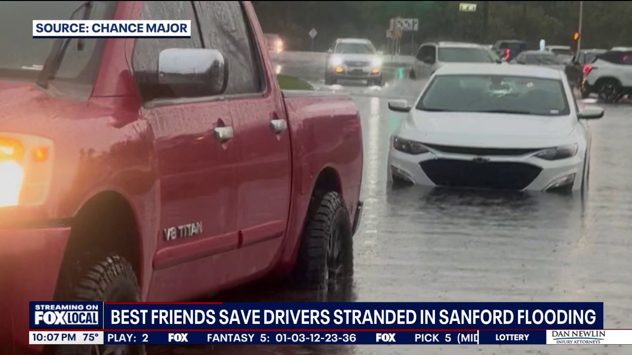 Best friends rescue drivers stranded in flooded Sanford intersection