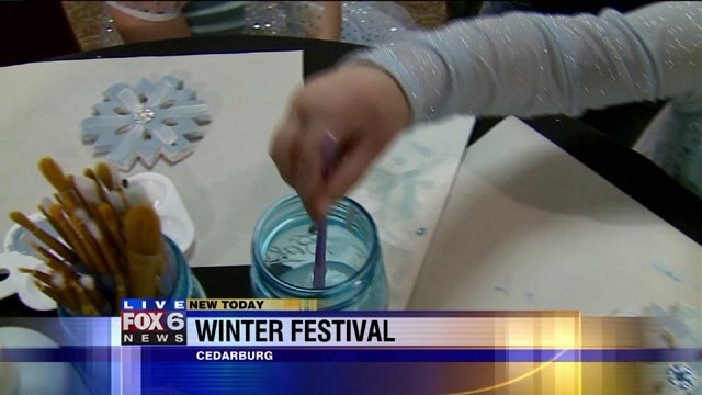 Laura gets details on a tea party being held during the Cedarburg Winter Festival