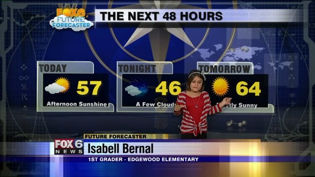 Isabell Bernal helps Meteorologist Stephanie Barichello with the weather