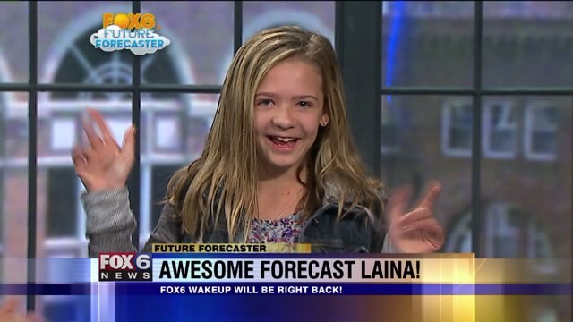 Laina Allison helps Meteorologist Rob Haswell with the weather
