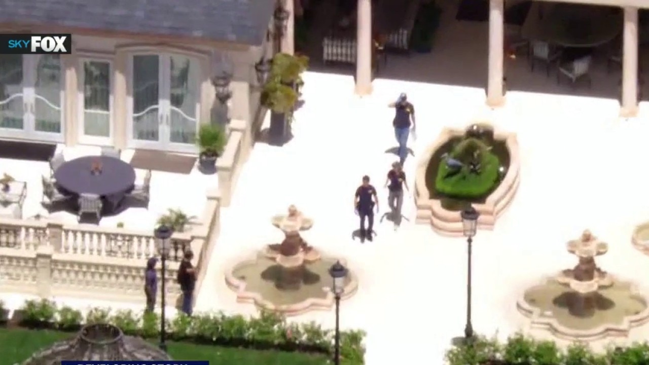FBI agents serve search warrant at Beverly Hills mansion
