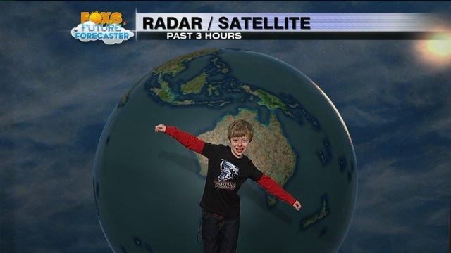 Thatcher helps FOX6 and Meteorologist Rob Haswell with the weather