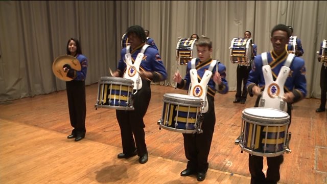 Chip talks with band director at Rufus King High School
